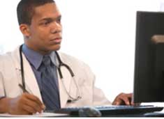 Doctor looking at computer